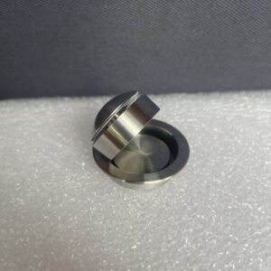 A metal object sitting on top of a table.