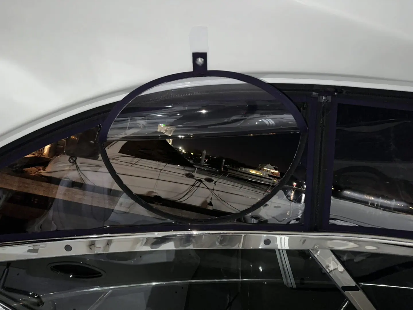 A mirror reflecting the reflection of a plane.