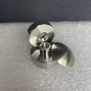 A close up of the bottom part of a metal object.